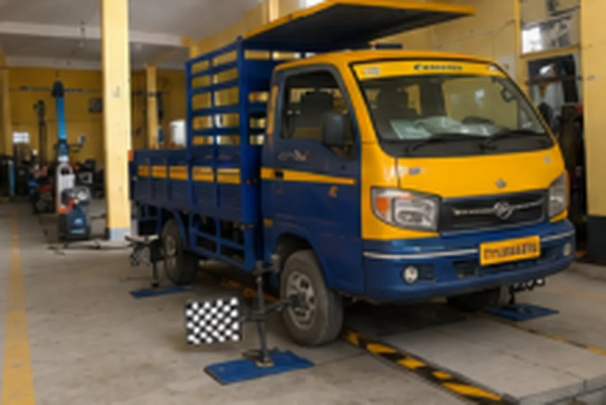 Light commercial truck on the wheel alignment ramp